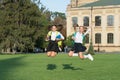Unstoppable energy of little jumping schoolgirls school background, celebrate september concept
