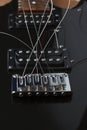 Unstretched strings in an electric guitar bridge. Guitar with two humbuckers. Royalty Free Stock Photo