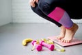 Unsuccessful slimming. Shocked asian fat woman standing on weight-scales weighing after weight gain at home Royalty Free Stock Photo