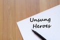 Unsung heroes write on notebook Royalty Free Stock Photo