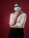 Unsure businesswoman with face mask