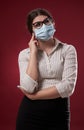 Unsure businesswoman with face mask