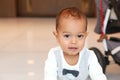 Unsure cute toddler boy in suit with bowtie Royalty Free Stock Photo