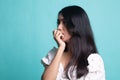 Unsure hesitant nervous young asian  woman biting her fingernails Royalty Free Stock Photo