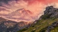 Unsurpassed sunrise in the mountains. Majestic Sunset. Overkast sky over Rock Peak under sunlit. Awesome Alpine highlands in Royalty Free Stock Photo