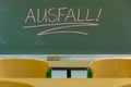 `Canceled lesson` are written on the blackboard lesson. In German. Royalty Free Stock Photo