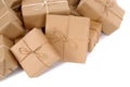 Pile of brown paper parcels or packages isolated on white