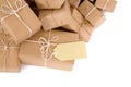 Lots or collection of brown paper parcels with manila label isolated on white background