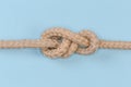 Untightened rope Stevedore knot on a blue background Royalty Free Stock Photo