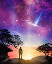 Stargaze, falling star, connection with the Universe, man silhouette on a cliff