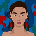 Bright portrait of a beautiful girl with earrings on an abstract blue background Royalty Free Stock Photo