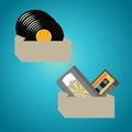 Two boxes one with vinyl audio records and the second with audio and video cassettes Royalty Free Stock Photo