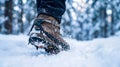 Hiker\'s Boot with Crampons Kicking Up Snow in a Winter Landscape Royalty Free Stock Photo