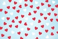 Small red and  white hearts on the blue background. Royalty Free Stock Photo