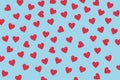 Small red hearts on the blue background. Royalty Free Stock Photo