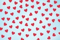 Small red hearts on the blue background. Royalty Free Stock Photo