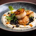Fine dining seared scallops with sauce and on top with caviar, food photography