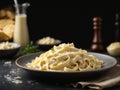 Fettuccine alfredo with parmesan cheese isolated on black background