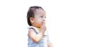 Asian Baby Toddler is Sucking the Index Finger of His Hand when he is Shy or thinking, On Isolated White Background Royalty Free Stock Photo