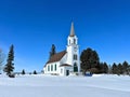 An adorable little country church surrounded by fresh snow Royalty Free Stock Photo