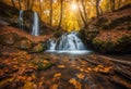 Beautiful waterfall in autumn forest in crimean mountains at sun Royalty Free Stock Photo