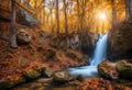 Beautiful waterfall in autumn forest in crimean mountains at sun Royalty Free Stock Photo