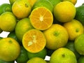 Calamodin whole and half citrus fruit Royalty Free Stock Photo