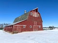 A quintessential red barn in the winter snow Royalty Free Stock Photo