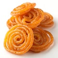 crispy golden jalebi stack on white background Royalty Free Stock Photo