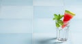 Refreshing Watermelon Mint Drink on Blue Tiles with Clean Minimal Background Royalty Free Stock Photo