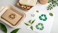 Recyclable packaging and eco-friendly tableware displayed on a light surface. Royalty Free Stock Photo