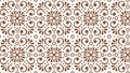 Symmetrical, repeating floral-inspired pattern in brown on a white background. Royalty Free Stock Photo