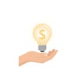 A hand holding a glowing light bulb with a dollar sign symbol inside the filament. Royalty Free Stock Photo