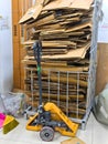 Malaysia November 2 2025 Stacked Cardboard Sheets With Pallet Jack In Storage Area Royalty Free Stock Photo