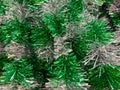 Close-up of green and silver tinsel garlands with shimmering festive texture and metallic shine Royalty Free Stock Photo