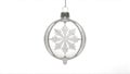 A clear glass Christmas ornament with a silver snowflake design hangs against a white background Royalty Free Stock Photo