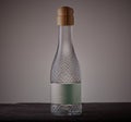 White wine bottle on grey background. Royalty Free Stock Photo