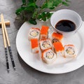 Untraditional Rolls with cucumber, omelet and ham on a plate. Sushi Royalty Free Stock Photo