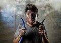 Untrained man joining electrical cable suffering electrical accident with dirty burnt face in funny shock expression Royalty Free Stock Photo