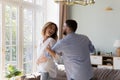 Untroubled couple in love dance together at modern home Royalty Free Stock Photo