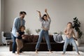 Untroubled family with children dancing together in living room Royalty Free Stock Photo