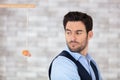 untrusting businessman looking over shoulder at dangling carrot Royalty Free Stock Photo