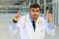 Untruthful healthcare worker crossing fingers Royalty Free Stock Photo