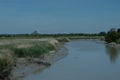 Marshland and a river in front of Mont-Saint-Michel, Bretagne, France Royalty Free Stock Photo