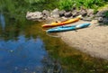 Unused kayaks by waters edge