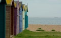 Locked Colorful Beach huts on a pebble beach Royalty Free Stock Photo