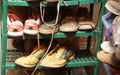 old shoes still arranged on plastic shelves