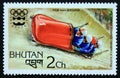 Unused post stamp Bhutan 1976, 4 men bobsleigh winter sports