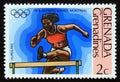 Unused postage stamp Grenada 1976, Hurdling olympic runner