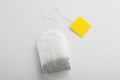 Unused tea bag with tag on white background, top view. Royalty Free Stock Photo